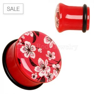 Red and black plugs with pink Japanese cherry blossoms