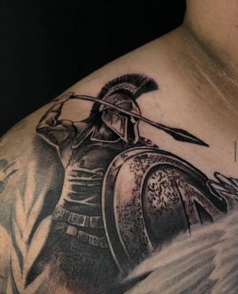 Black and white trojan warrior with spear & shield shoulder tattoo