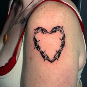 Shoulder tattoo of barbed wire heart