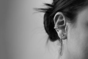 Closeup of woman's ear piercings